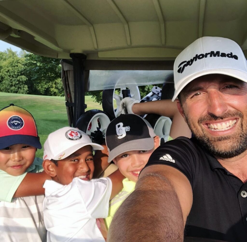 Three kids enjoy golf camp in Mississauga with instructor.